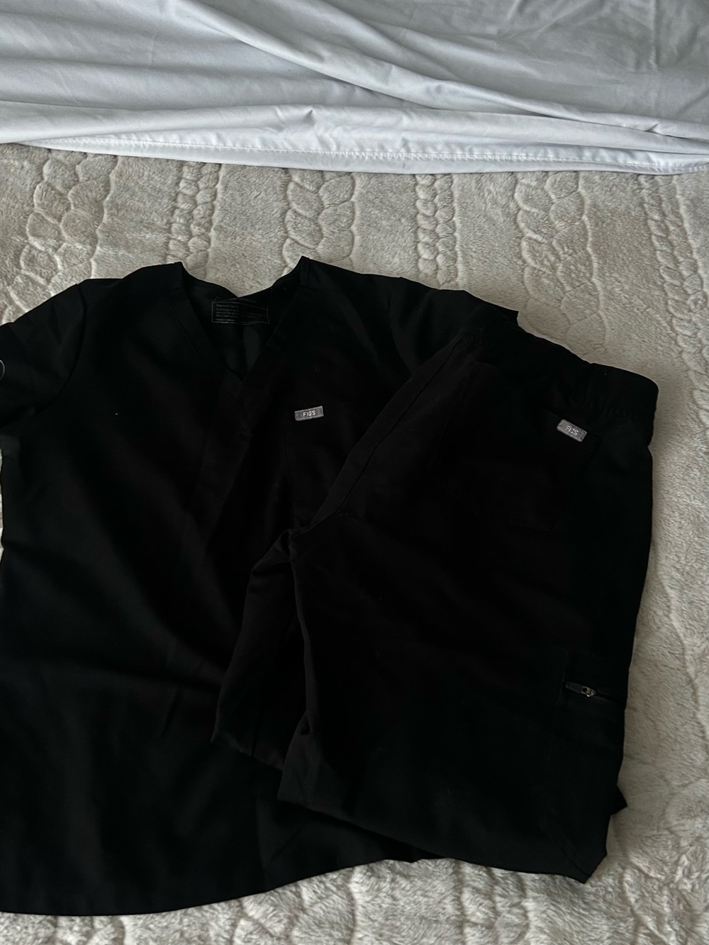 Women's black top with printed label